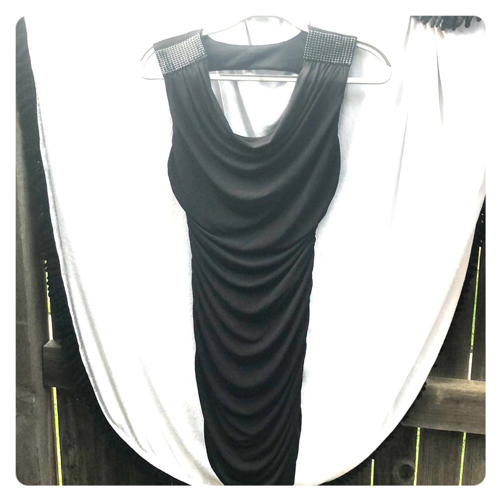 Black cocktail dress with shoulder embellishments